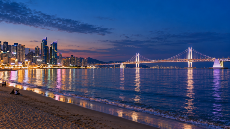 Gwangalli Beach and Gwangan Bridge glowing at blue hour in Busan