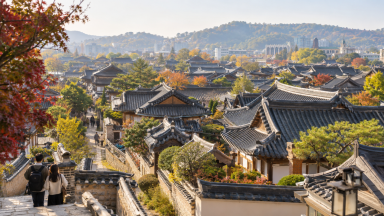 Travelers overlooking the traditional rooftops of Jeonju Hanok Village