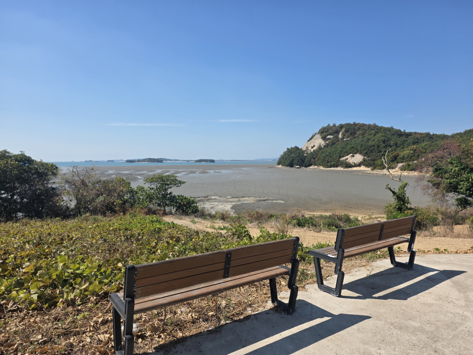Bench overlooking the tidal flats at a quiet sunset viewpoint on Soakdo